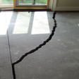 a huge crack in a concrete slab floor in Fresno