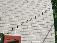 Stair-step cracks showing in a home foundation in San Mateo