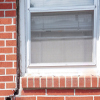 A gap in a window along the outer wall due to foundation settlement of a Concord home.
