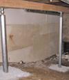 A system of crawl space support posts adding structural support to a crawl space in Tracy