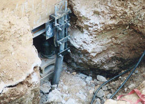 a bent, failed foundation push pier installed in Fresno.