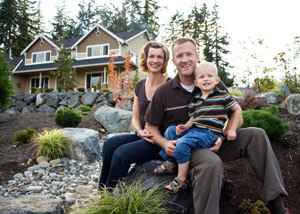 A happy family outside a home with a repaired foundation in Tracy